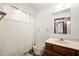 This bathroom features wood-look flooring, vanity sink, and shower tub at 155 Hoover Dr, , IN 46164