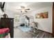 A fun bedroom with wood-look flooring, ceiling fan, and natural light at 155 Hoover Dr, , IN 46164