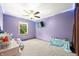 A vibrant bedroom with a ceiling fan, natural light, and neutral carpet at 155 Hoover Dr, , IN 46164