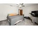 A cozy bedroom offers neutral carpet, ceiling fan, and ample natural light at 155 Hoover Dr, , IN 46164
