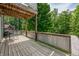 Wooden deck space with metal railing and table with four chairs at 155 Hoover Dr, , IN 46164