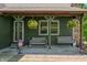 Inviting covered porch featuring hanging floral baskets and comfortable seating at 155 Hoover Dr, , IN 46164