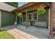 Inviting covered porch featuring hanging floral baskets and comfortable seating at 155 Hoover Dr, , IN 46164