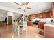 Open kitchen with wooden cabinets, stainless steel appliances, eat-in table, and ceiling fan at 155 Hoover Dr, , IN 46164