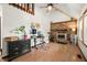 Living room with high ceilings, a ceiling fan, brick fireplace, and a large window at 155 Hoover Dr, , IN 46164