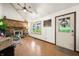 Living room with a brick fireplace, two windows, and a door that leads outside at 155 Hoover Dr, , IN 46164