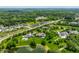 Expansive aerial view of a luxurious community with tree-lined streets, green spaces, and serene pond at 18 Lost Run Ln, Zionsville, IN 46077