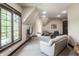 Spacious bonus room with large window, comfortable seating, and neutral decor at 18 Lost Run Ln, Zionsville, IN 46077