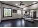 Bright exercise room with a treadmill, mirrored wall, and ample natural light at 18 Lost Run Ln, Zionsville, IN 46077