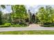 Gorgeous stone and wood home with beautiful landscaping and mature trees creating great curb appeal at 18 Lost Run Ln, Zionsville, IN 46077