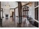 Open foyer boasts soaring ceilings, dark wood floors, stone accents and elegant lighting at 18 Lost Run Ln, Zionsville, IN 46077
