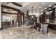 Spacious kitchen and living area, with travertine floors, beams, and custom wood cabinets at 18 Lost Run Ln, Zionsville, IN 46077