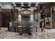 Stunning kitchen with custom wood cabinetry, stone backsplash, and an island with seating at 18 Lost Run Ln, Zionsville, IN 46077