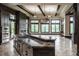 Gourmet kitchen with stone accents, lots of natural light, and stone flooring at 18 Lost Run Ln, Zionsville, IN 46077