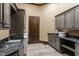 Well-equipped laundry room with custom cabinets, granite countertops, and plenty of storage space at 18 Lost Run Ln, Zionsville, IN 46077