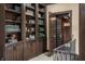 Beautiful library with custom built-in bookshelves and access to a private elevator at 18 Lost Run Ln, Zionsville, IN 46077