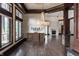 Elegant living room showcasing hardwood floors, stone accents, a fireplace, and detailed trim at 18 Lost Run Ln, Zionsville, IN 46077