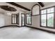 Bright living room featuring neutral carpet and large windows with a view of the surrounding landscape at 18 Lost Run Ln, Zionsville, IN 46077