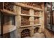 Custom wine cellar displaying terracotta pipes for storage in a unique design at 18 Lost Run Ln, Zionsville, IN 46077