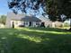 Expansive backyard with mature trees, providing shade and privacy for outdoor activities and relaxation at 1820 Irish Lake Ln, Indianapolis, IN 46239