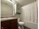 Bathroom featuring a combination shower and tub, a vanity with storage, and neutral colors at 1820 Irish Lake Ln, Indianapolis, IN 46239