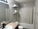 Bathroom featuring a combination shower and tub, a vanity, and updated fixtures at 1820 Irish Lake Ln, Indianapolis, IN 46239