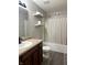 Bathroom featuring a combination shower and tub, a vanity, and updated fixtures at 1820 Irish Lake Ln, Indianapolis, IN 46239