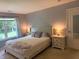 Bedroom with a neutral palette, and illuminated by bedside lamps at 1820 Irish Lake Ln, Indianapolis, IN 46239