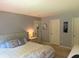 Bedroom with a neutral palette, and illuminated by a bedside lamp at 1820 Irish Lake Ln, Indianapolis, IN 46239