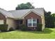 Charming brick and vinyl home with tidy landscaping, offering a welcoming entrance and curb appeal at 1820 Irish Lake Ln, Indianapolis, IN 46239