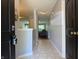 Inviting foyer with tile flooring, neutral paint, and a view into the living spaces of the home at 1820 Irish Lake Ln, Indianapolis, IN 46239