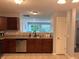 Modern kitchen featuring stainless appliances and a view into the bright and airy living area at 1820 Irish Lake Ln, Indianapolis, IN 46239