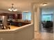 Open concept showcasing the kitchen and living room with stainless appliances and cozy furniture at 1820 Irish Lake Ln, Indianapolis, IN 46239