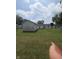 Spacious backyard with lush green lawn and detached garage, offering ample outdoor space at 206 Allen Ln, Greenfield, IN 46140
