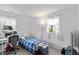 Simple bedroom with bright natural light from the windows and minimal decor at 206 Allen Ln, Greenfield, IN 46140