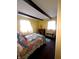 Comfortable bedroom with natural light, decorative beams and quilt at 206 Allen Ln, Greenfield, IN 46140