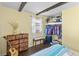 Inviting bedroom boasting exposed beams, natural light, and ample storage with a large closet at 206 Allen Ln, Greenfield, IN 46140