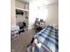 Bedroom with a closet, desk, and blue plaid bedding provides a simple and functional space at 206 Allen Ln, Greenfield, IN 46140