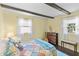 Comfortable bedroom featuring exposed beams, soft lighting, and a relaxing atmosphere at 206 Allen Ln, Greenfield, IN 46140