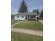 Charming ranch-style home featuring a well-maintained lawn, inviting curb appeal, and tidy landscaping at 206 Allen Ln, Greenfield, IN 46140