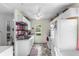 Bright kitchen with white cabinetry, red backsplash, and stainless-steel appliances at 206 Allen Ln, Greenfield, IN 46140