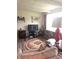 Cozy living room featuring nice flooring, warm lighting, and ample space for furniture and entertainment at 206 Allen Ln, Greenfield, IN 46140