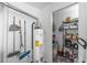 Functional utility room featuring storage shelves and essential home maintenance equipment at 206 Allen Ln, Greenfield, IN 46140