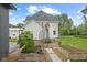 Landscaped backyard area with raised garden beds and a barn behind the house at 211 N County Line Rd, , IN 47272
