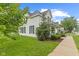 Well-maintained two-story house with a classic design, green lawn and sidewalk at 211 N County Line Rd, , IN 47272