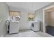 Light filled laundry room with modern machines and stylish accents at 211 N County Line Rd, , IN 47272