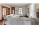 Cozy living area with white slip-covered sofas, hardwood floors, and natural light at 211 N County Line Rd, , IN 47272