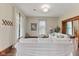 Bright living room featuring hardwood floors, large windows, and comfortable white sofas at 211 N County Line Rd, , IN 47272