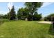 Expansive backyard featuring a gazebo, storage shed and mature trees for shade and privacy at 220 E Tilden Dr, Brownsburg, IN 46112