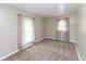Inviting bedroom with neutral carpet and plenty of natural light from two windows with curtains at 220 E Tilden Dr, Brownsburg, IN 46112